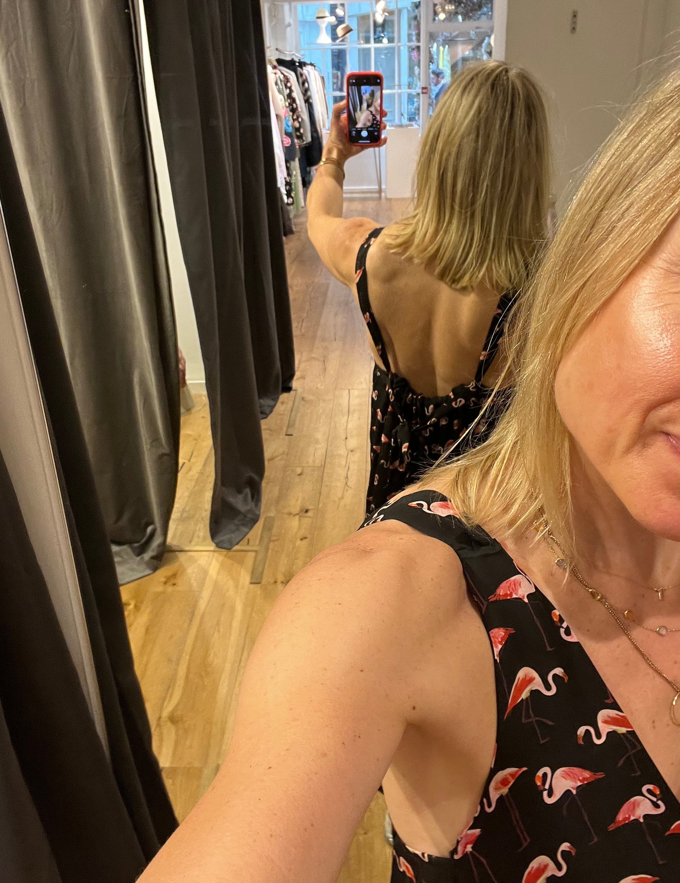 Rebecca wearing a flamingo print dress