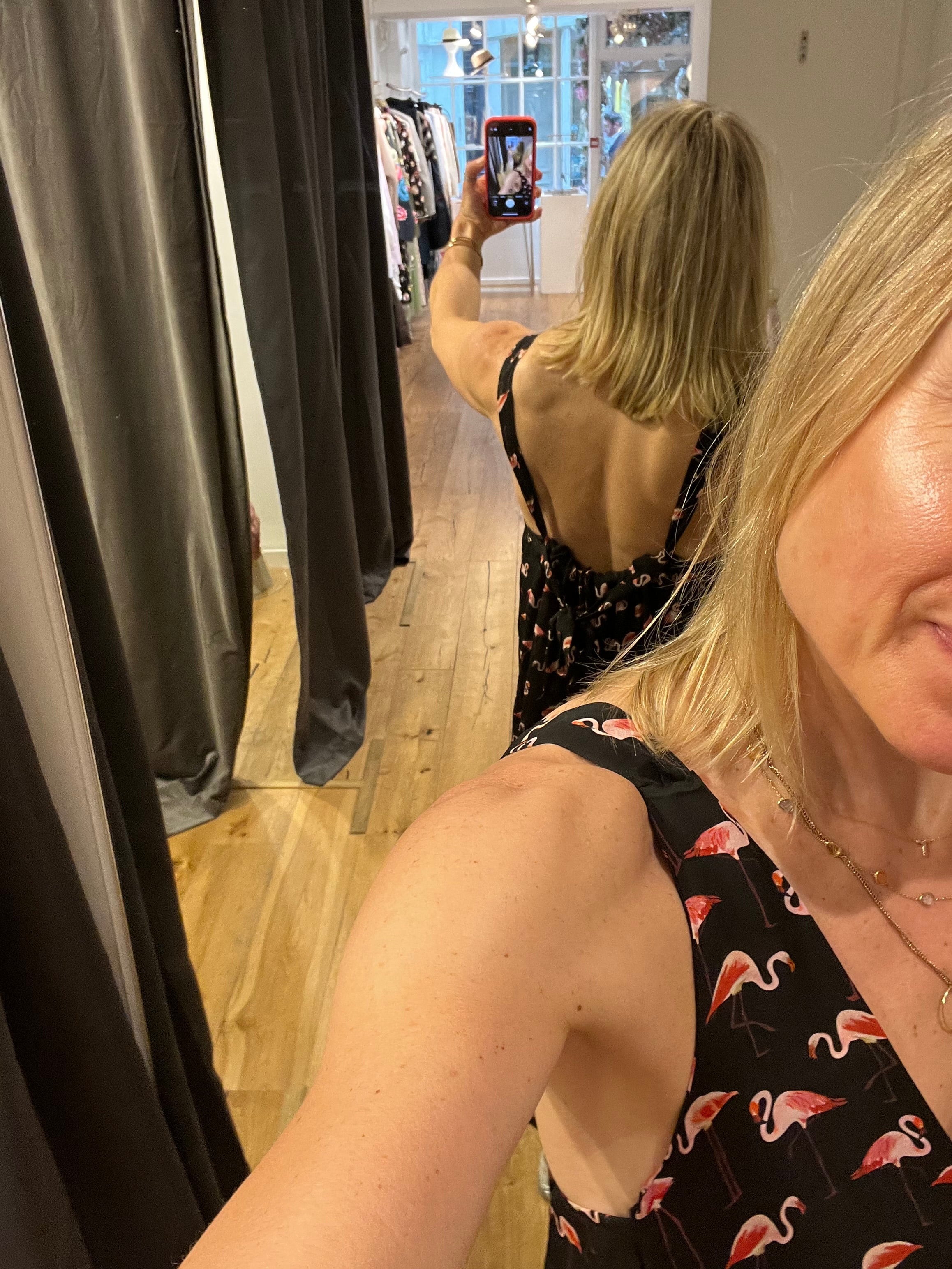 Rebecca wearing a flamingo print dress