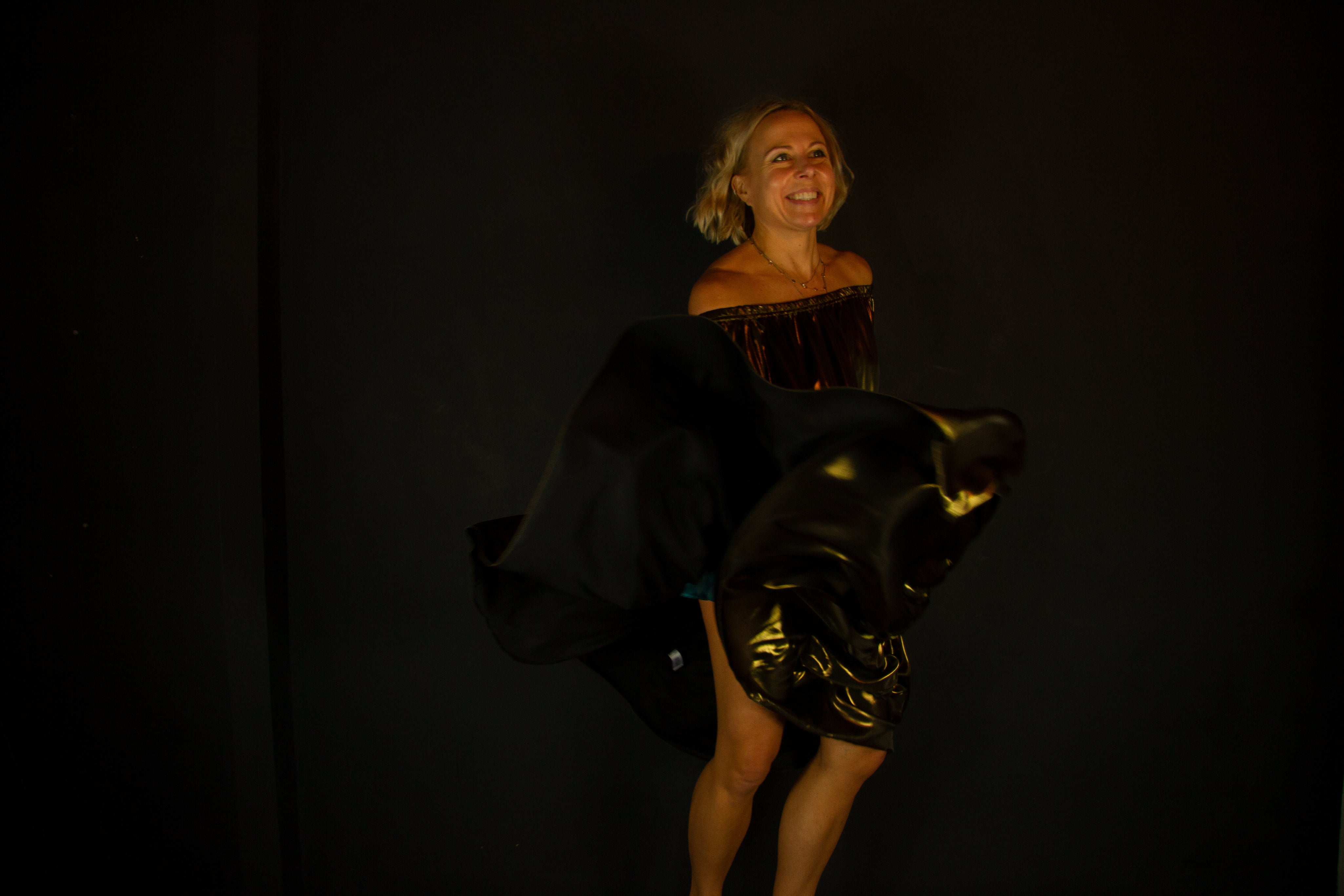 Rebecca wearing Ausus in metallic gold maxi dress