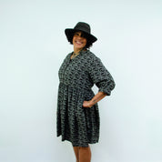 woman wearing hat in Sara - Monochrome Linear Print Skater Style Shirt Dress