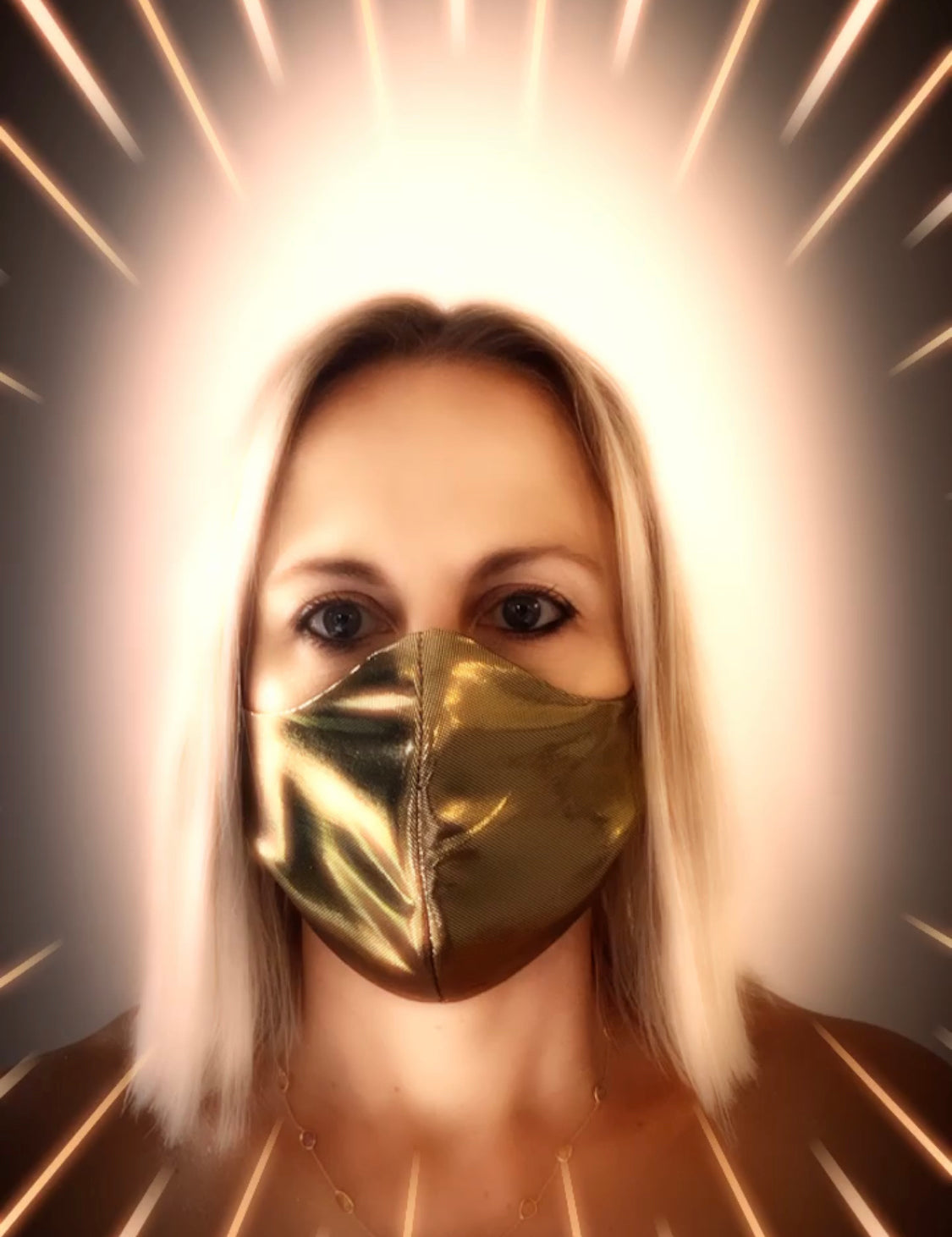 Rebecca Rodden with gold mask on face and halo around head