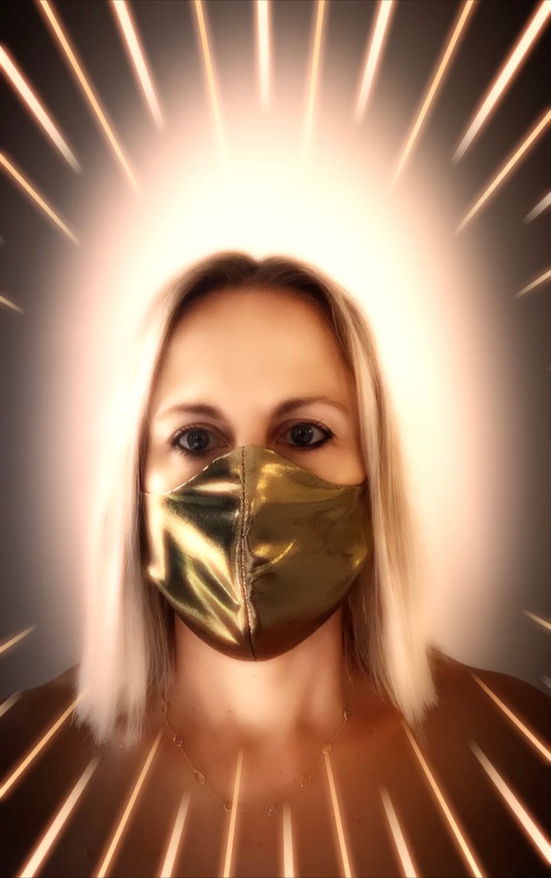 Rebecca Rodden with gold mask on face and halo around head