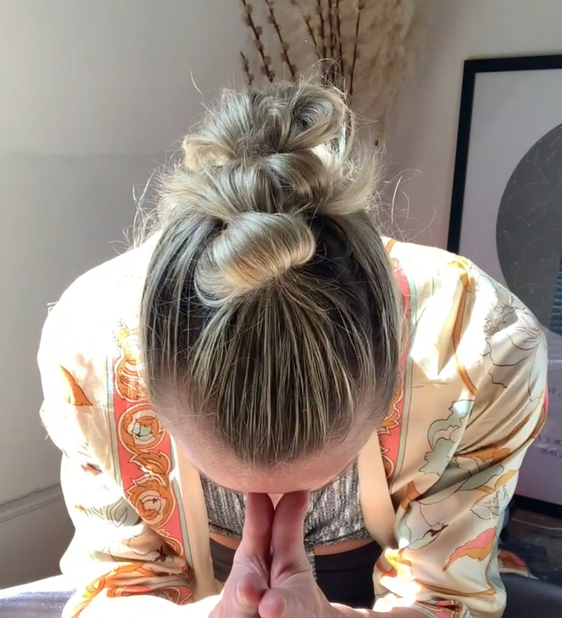 Rebecca bowing with hands at prayer
