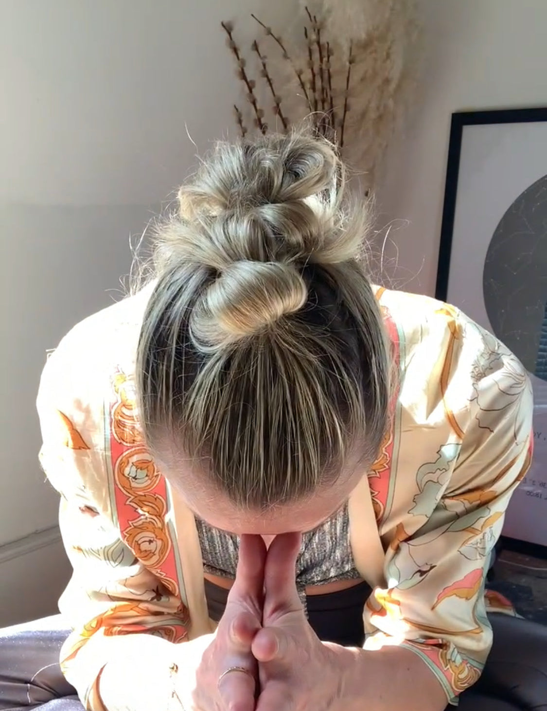 Rebecca bowing with hands at prayer