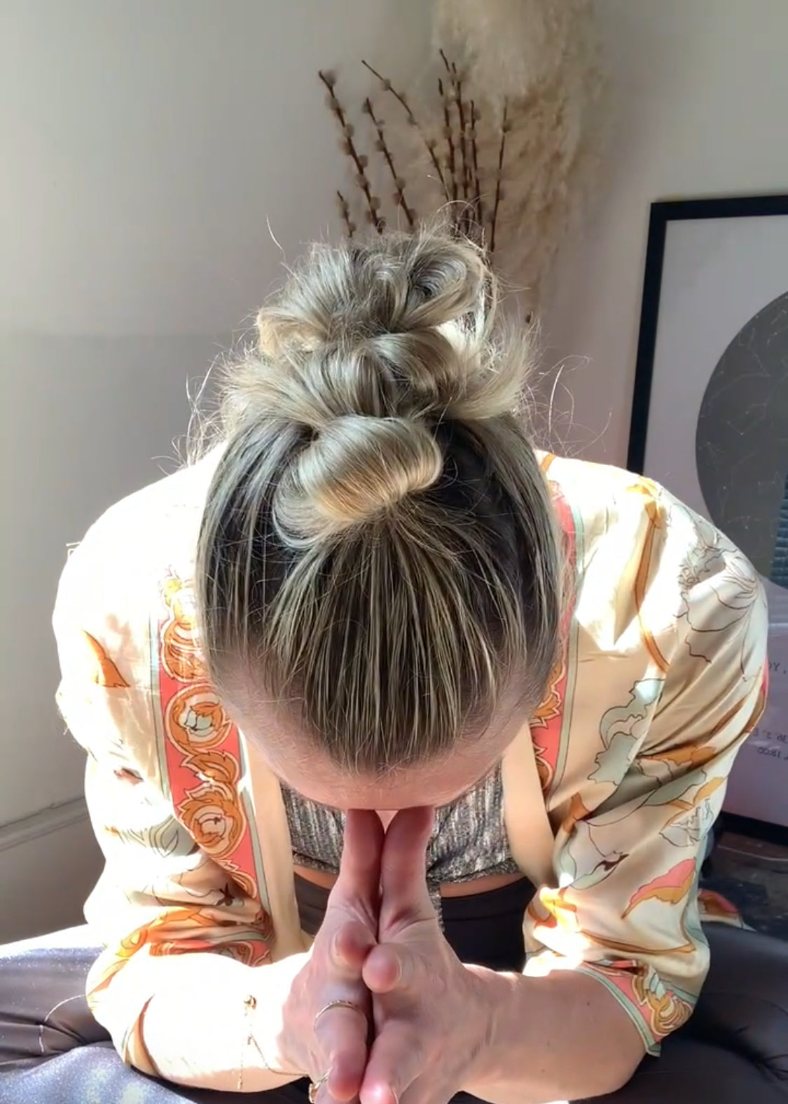 Rebecca bowing with hands at prayer