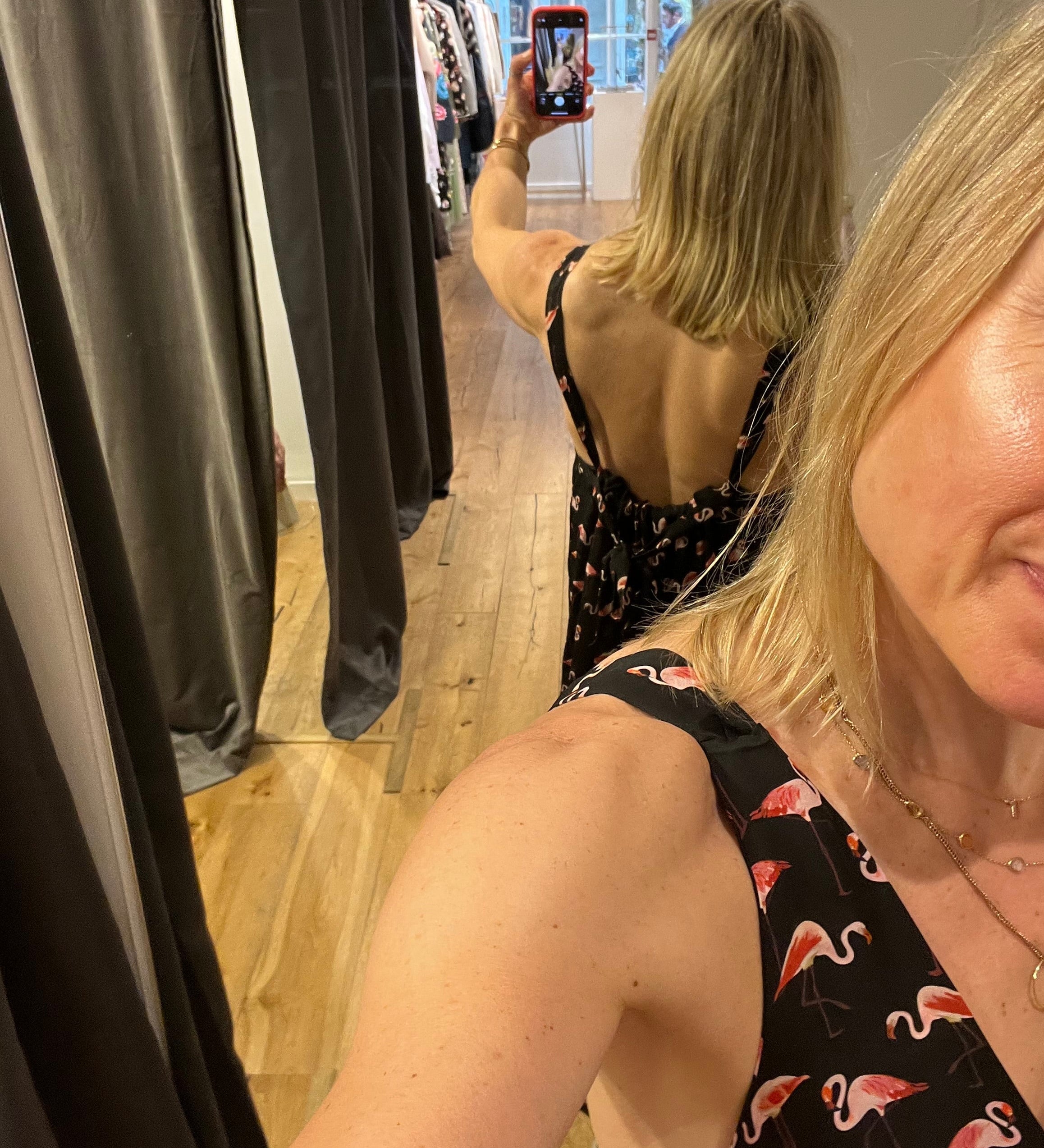 Rebecca wearing a flamingo print dress