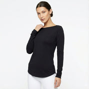 Woman wearing a black long-sleeve top on a white background