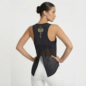 Woman wearing a black sleeveless top with a unique design on the back against a white background