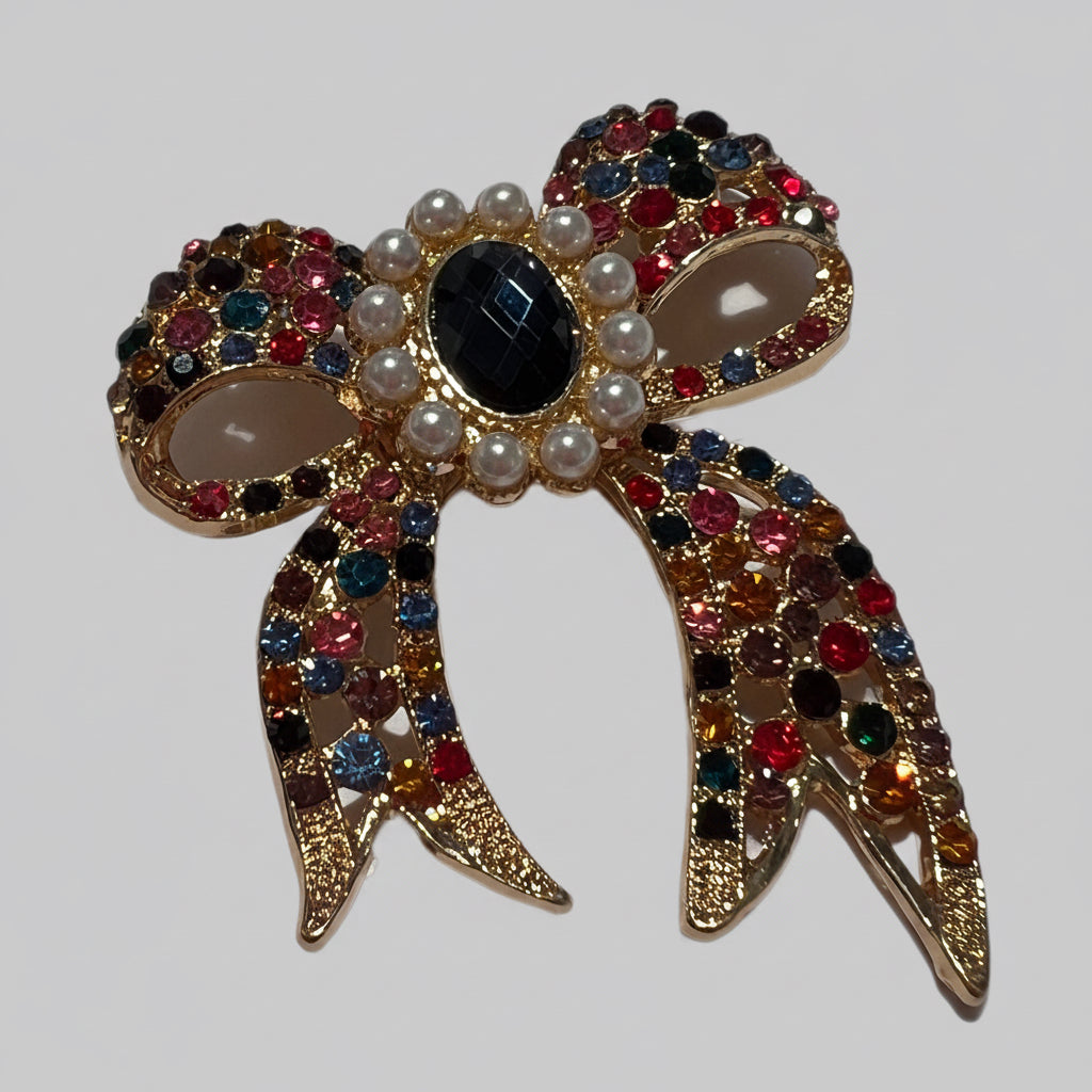 Decorative bow with colorful gemstones on a white background