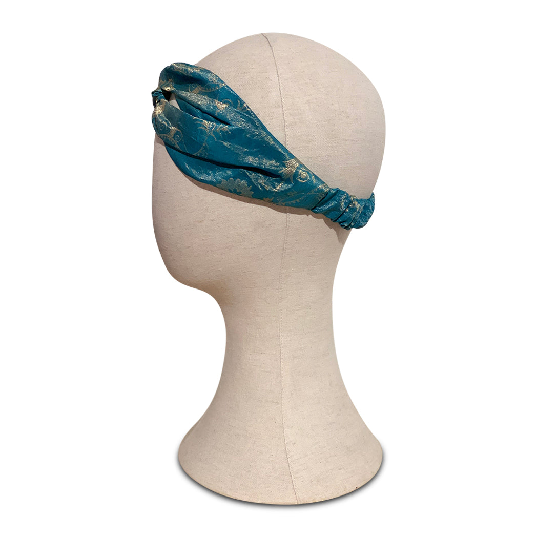 Turban headband made from  aqua vintage silk sari  on mannequin head 