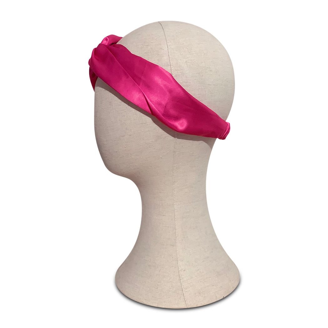 Turban headband made from super pink viscose silk on mannequin head