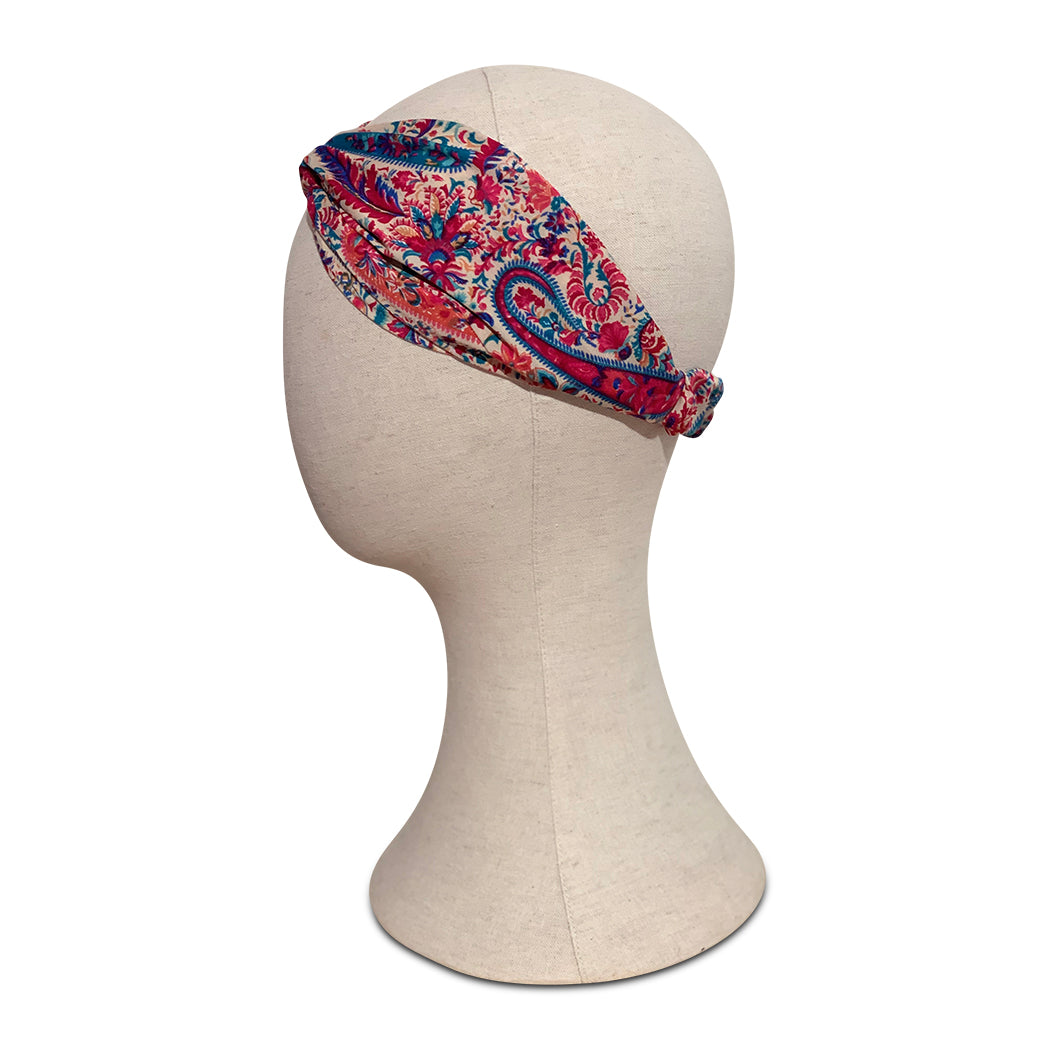 Turban headband made from paisley pink vintage silk sari on mannequin head