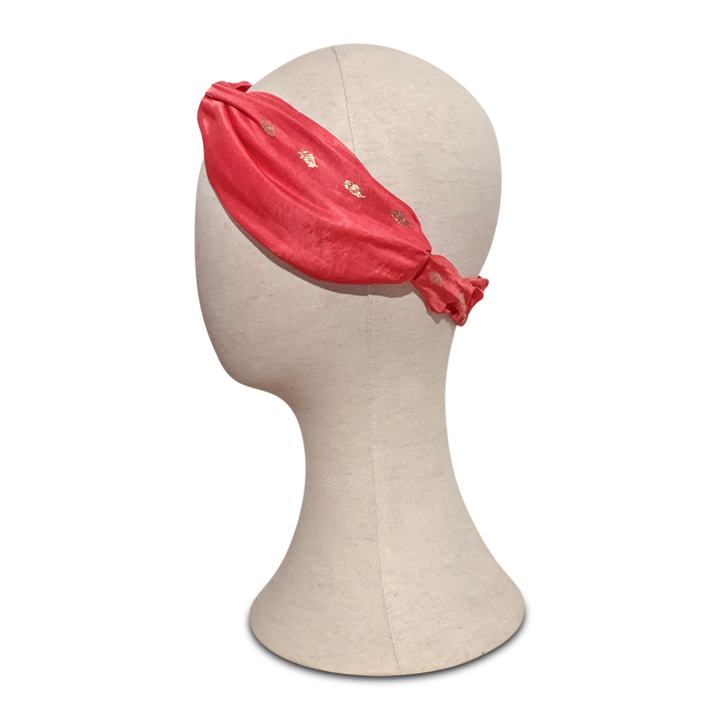 Turban headband made from pink vintage silk sari on mannequin head
