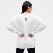 Woman wearing long sleeve oversized sweat with all seeing eye motif