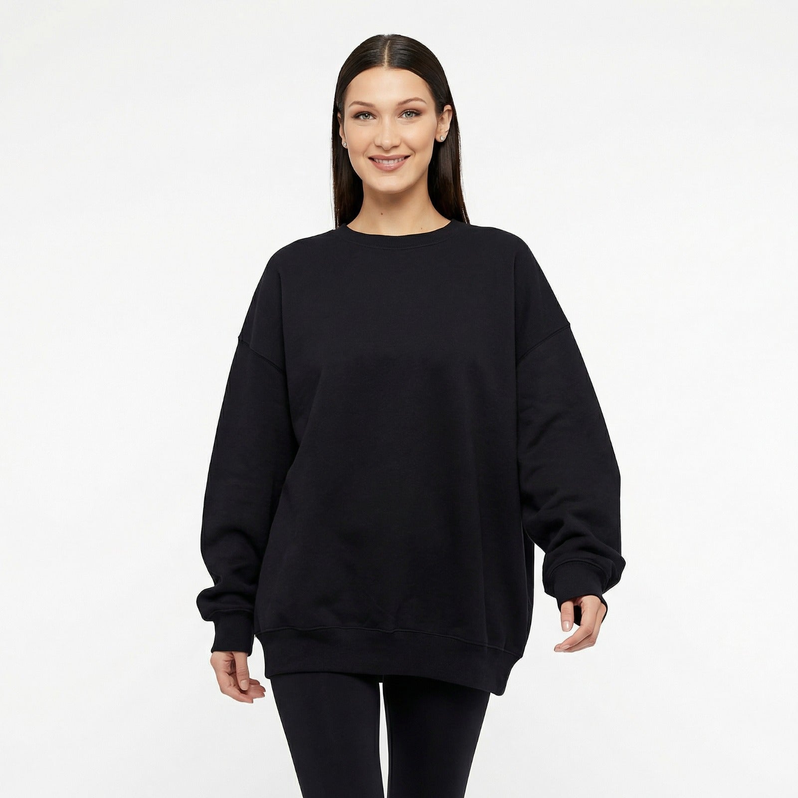 Woman wearing oversized sweat with all seeing eye motif in black front view 